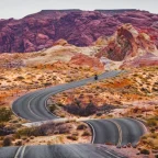 Traveler at a scenic US road trip overlook at golden hour