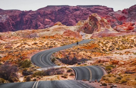 Traveler at a scenic US road trip overlook at golden hour