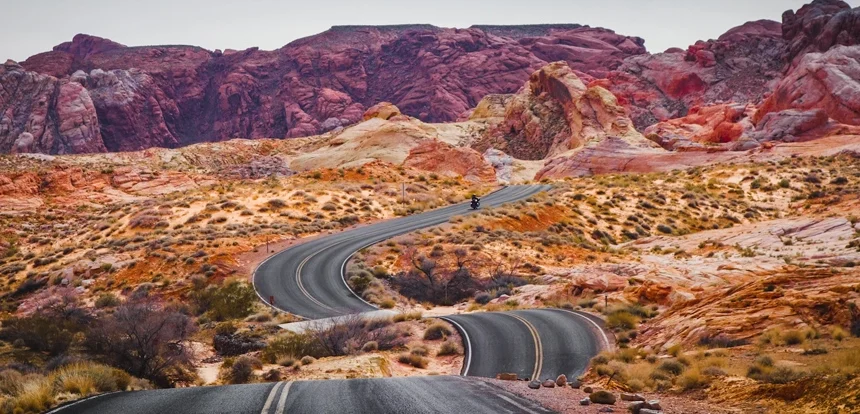 Traveler at a scenic US road trip overlook at golden hour