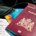 last-minute travel deals beside a passport and boarding pass