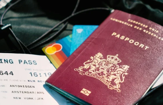 last-minute travel deals beside a passport and boarding pass