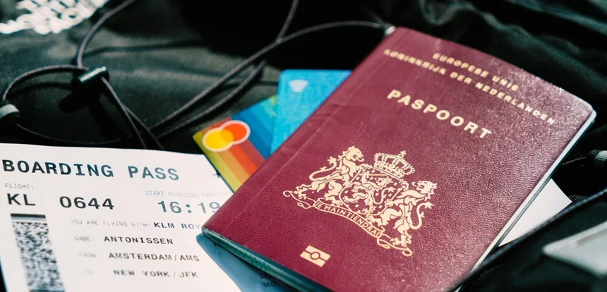 last-minute travel deals beside a passport and boarding pass