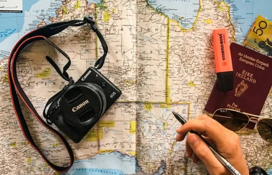 Close-up of a traveler using international map open