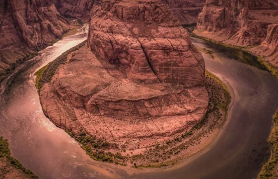 A sweeping U.S. national park overlook with canyon and mountain scenery at golden hour